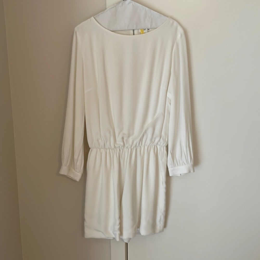 Long sleeve cream romper. **does have one stain on sleeve backside … 3rd photo